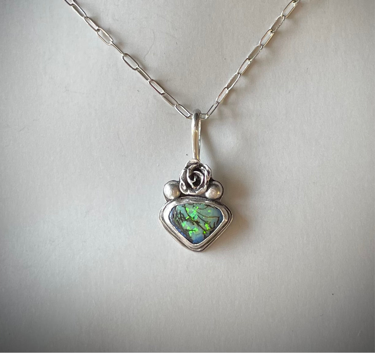 Lab opal with seton sterling silver with a silver rose accent