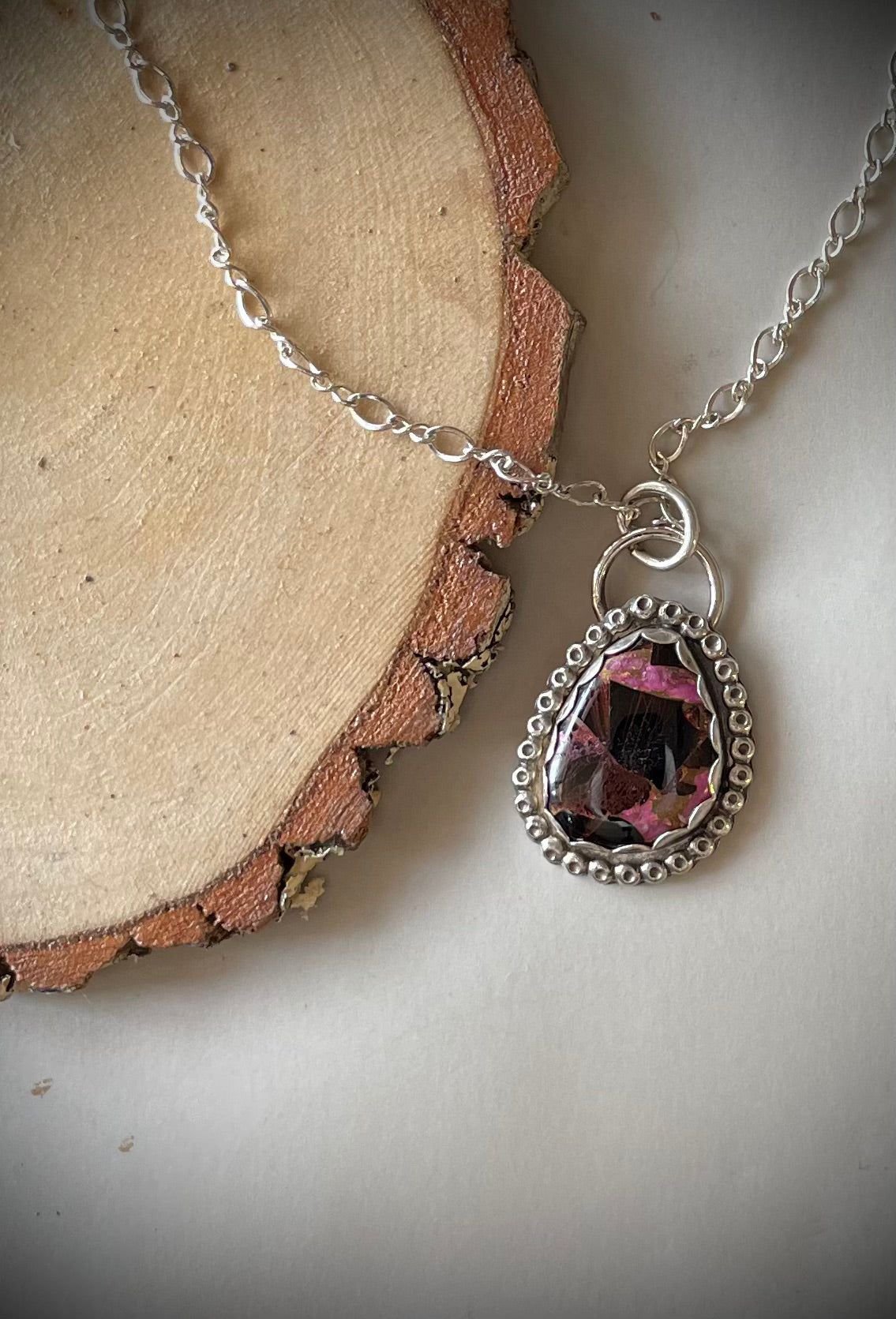 Purple composite turquoise with textured beaded wire set in sterling silver