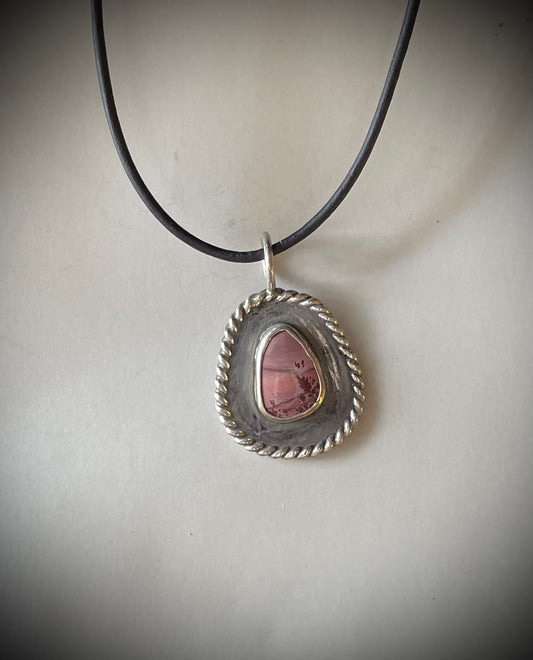 Apache rhyolite set in sterling silver hangs on 18 inch leather cord with sterling silver clasp