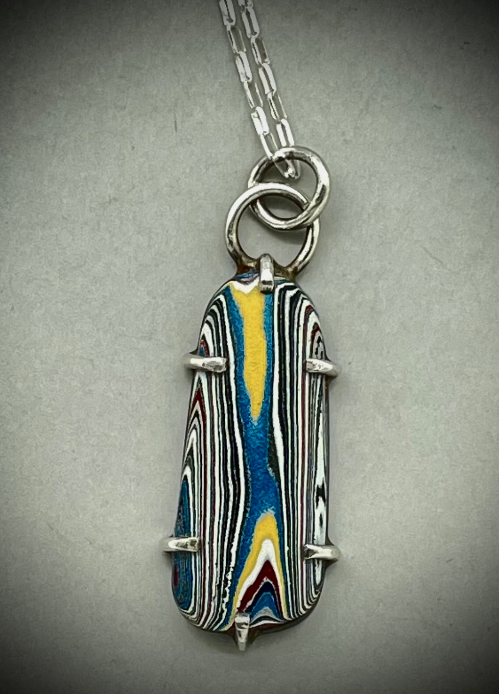 Fordite pendant